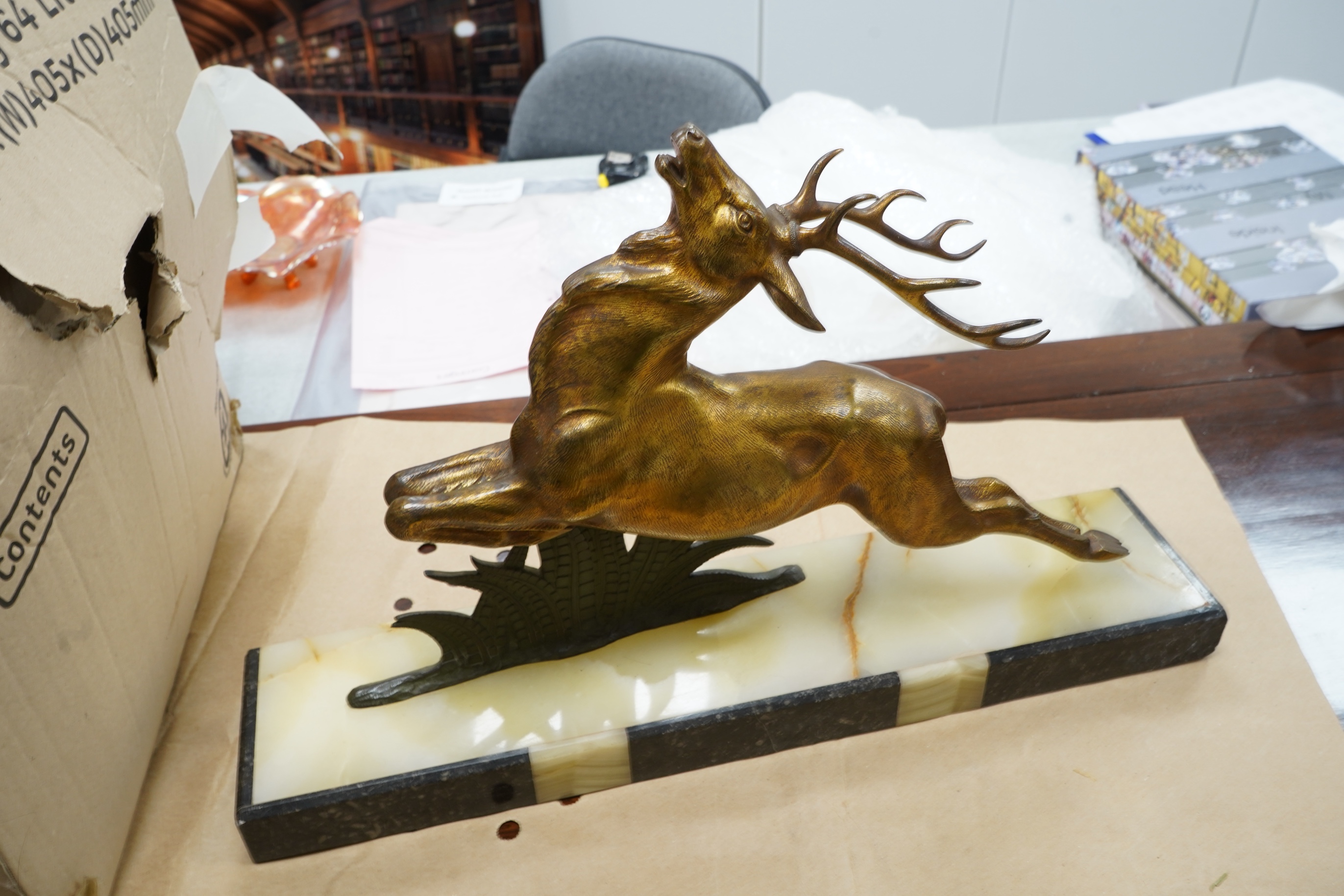 A French Bronze stag attributed to E Guy, on onyx base, 53cm wide x 33cm high